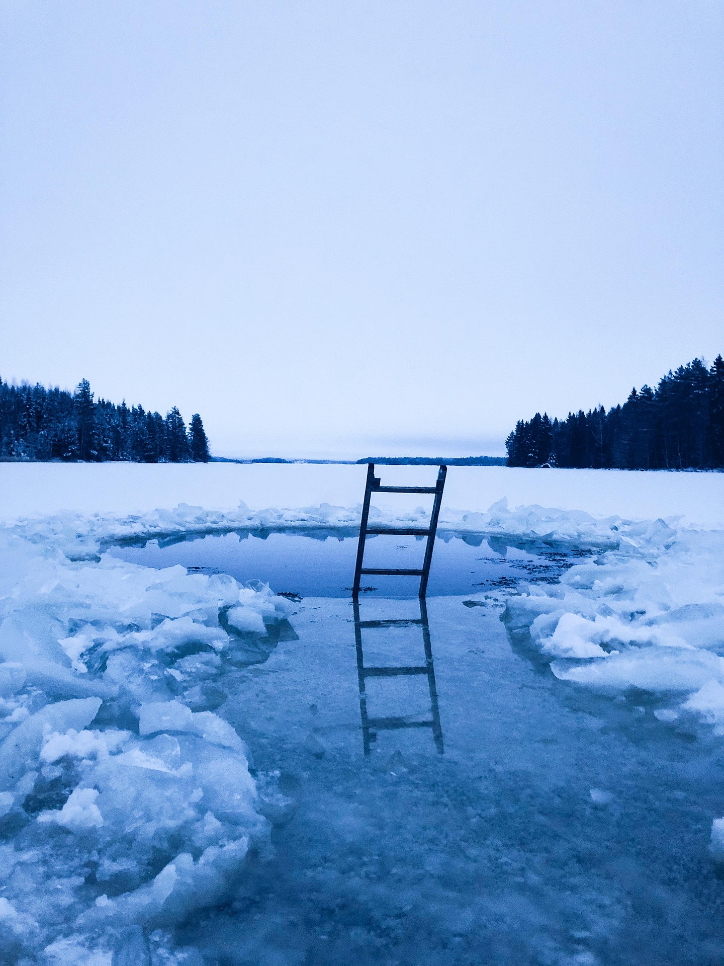 Illustration: ice swimming hole with steps on a frozen lake